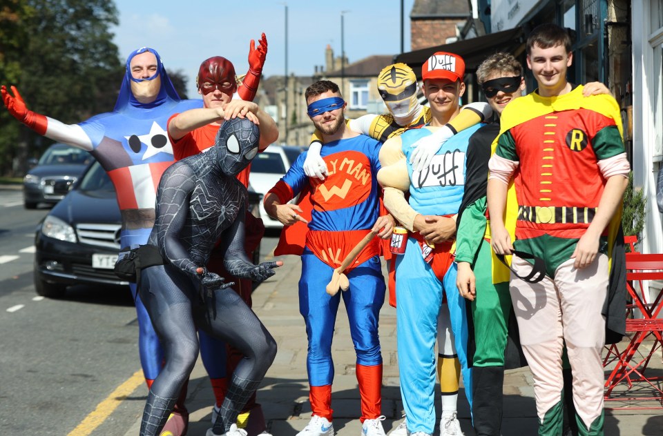 Superheros make their way to the next pub during the annual pub crawl