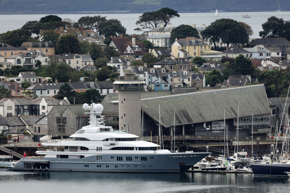 Rocinante towers over the other boats moored in Falmouth marina