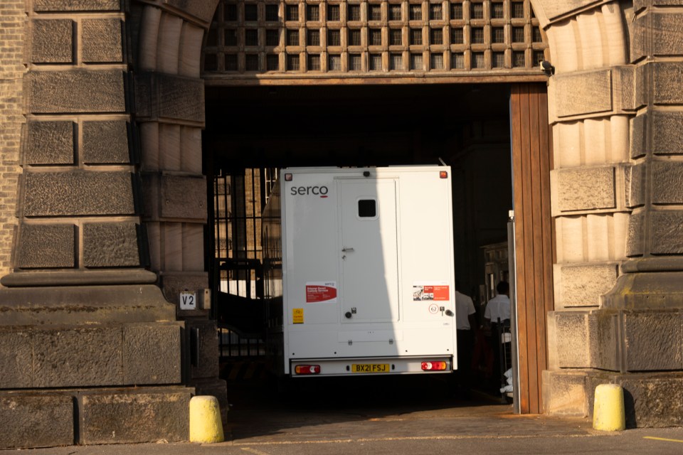 A prison van rolls through the main entrance of HMP Wandsworth on Thursday