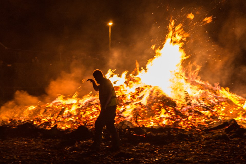 Each barrel is typically soaked in tar and set alight before it is raced down the streets.