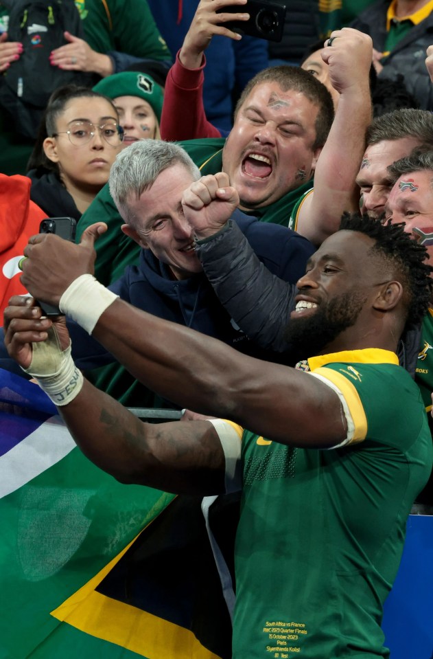 The skipper rejoices with fans after the Springboks' stunning 29-28 triumph over hosts France in the World Cup quarter-final last Sunday