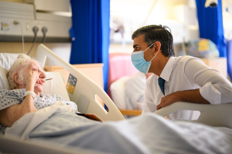 October, 2022: Rishi speaks with patient Brenda Boyling during a visit to Croydon University Hospital before his first autumn statement