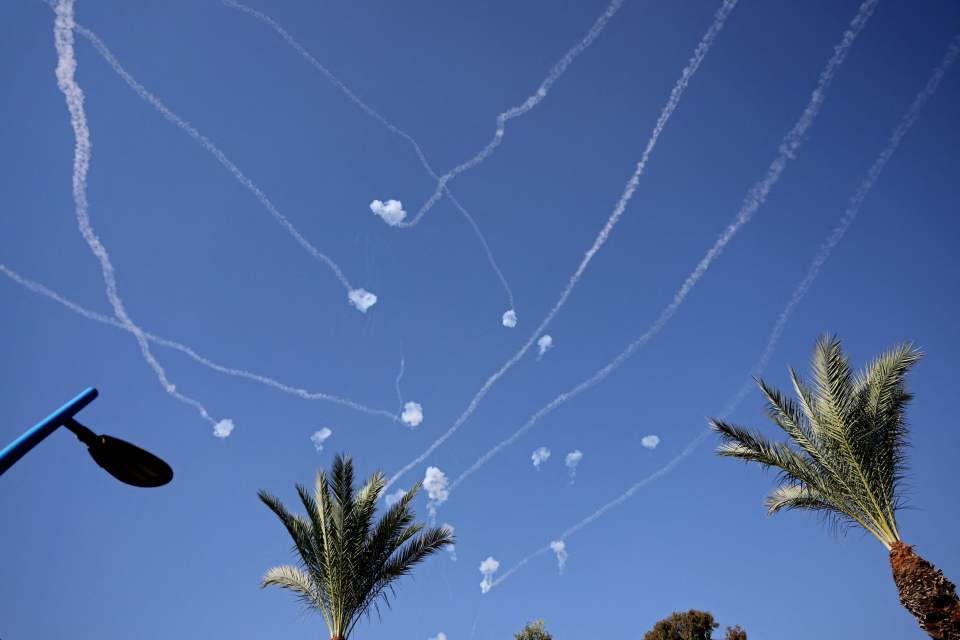 A picture taken from the Israeli city of Sderot shows rockets fired from the Gaza Strip intercepted by Israel’s Iron Dome defence missile system