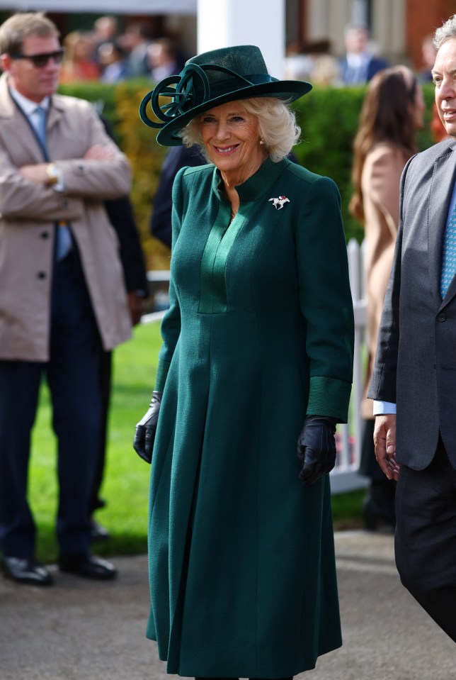 Queen Camilla was elegant in emerald at British Champions Day at Ascot racecourse today