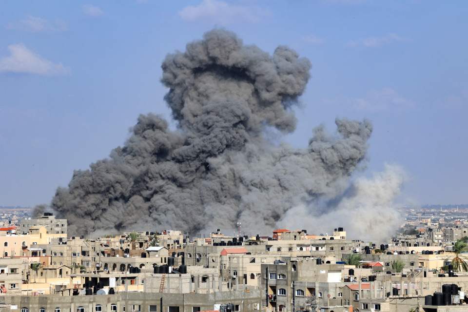 Smoke plumes billowing during Israeli air strikes on the southern Gaza Strip