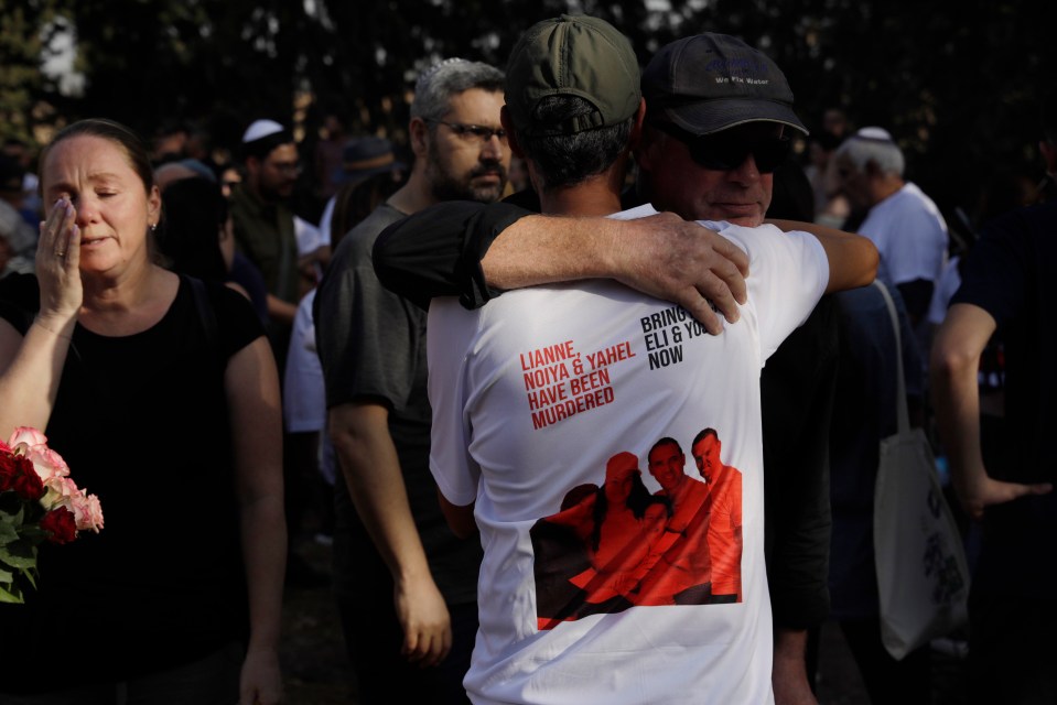 Mourners at the funeral for members of the Sharabi family, who were killed in the attack on Kibbutz Be’eri