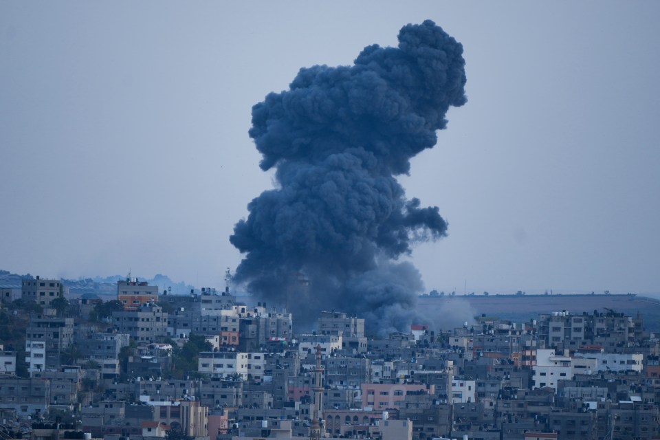 Black smoke rises into the air following an air strike on Gaza