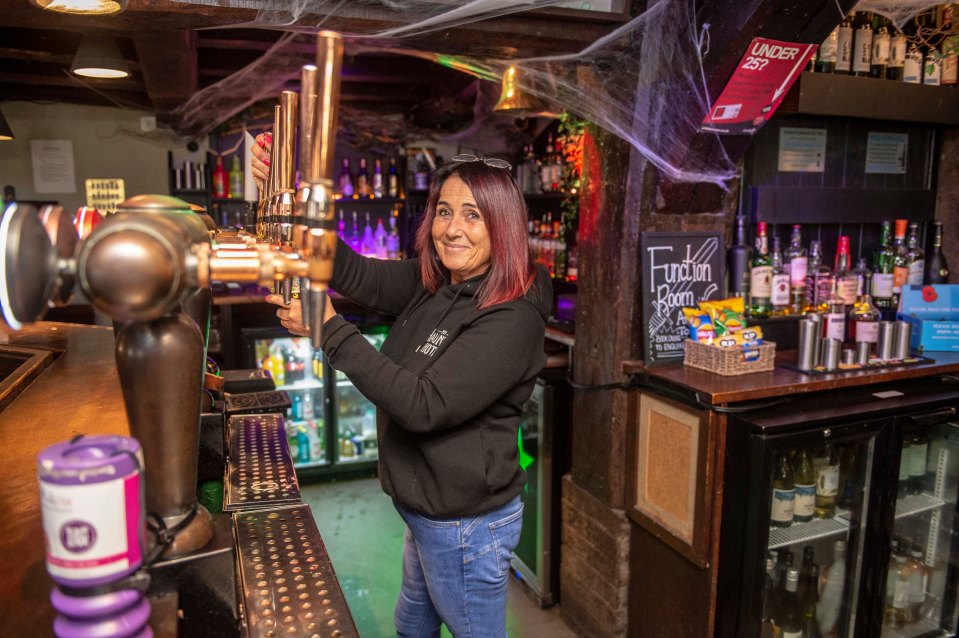 Barmaid Erica Dean says she's seen the willow doll tap on its glass case