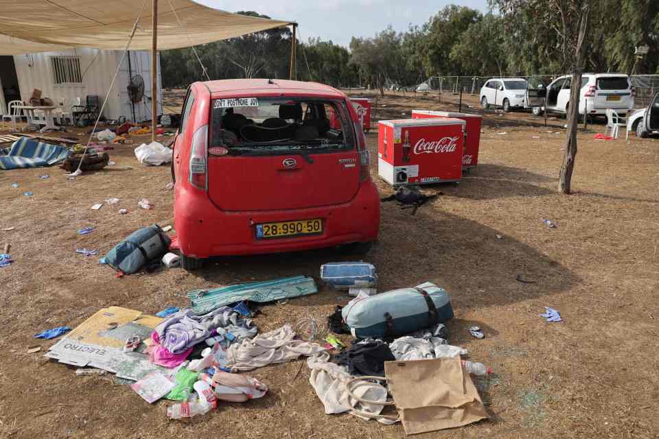 Belongings were strewn everywhere next to smashed and torched cars