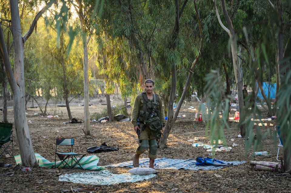 A soldier walks among scenes of devastation in the aftermath of the militants attack