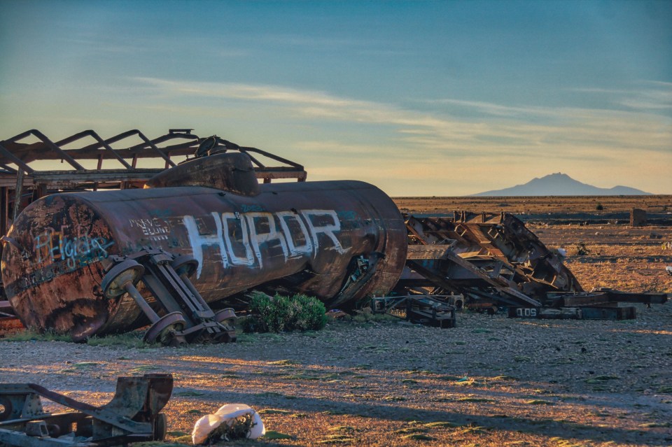 Over 100 old trains lie along the salt flat by the city of Uyuni