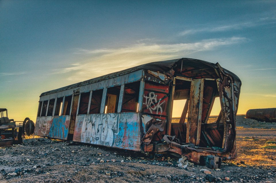 Now, the ruins of the steam trains litter the barren land