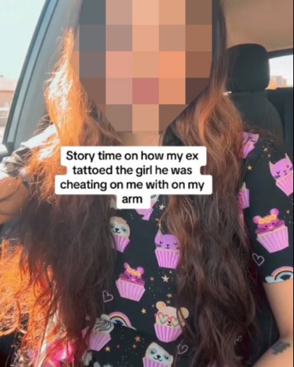 A woman was livid when she found out her man had tattooed what appeared to be the face of his ex-girlfriend, who he was allegedly cheating on her with, on her arm