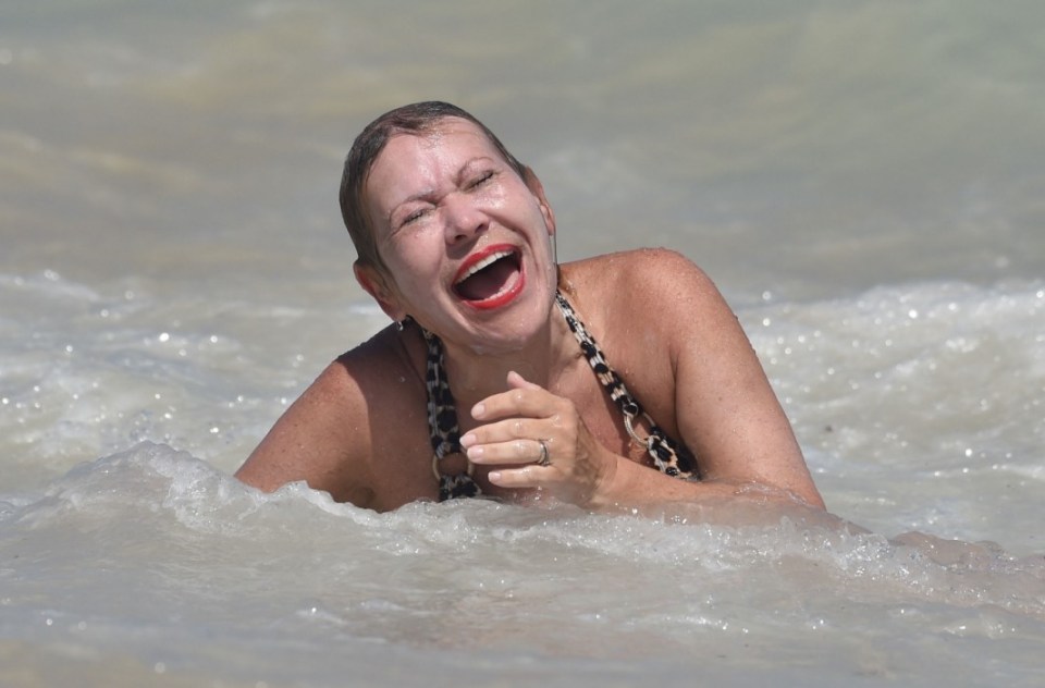 After creating a splash Tina was snapped laughing as she lay in the water