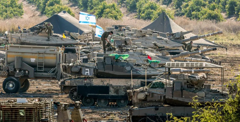 Israel has massed tanks and soldiers near the Gaza border ahead of a ground invasion