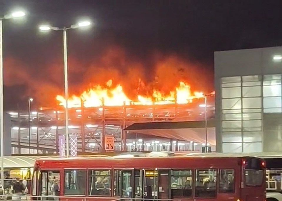 A driver has been quizzed over the horror blaze at Luton airport that burnt out over 1,500 cars