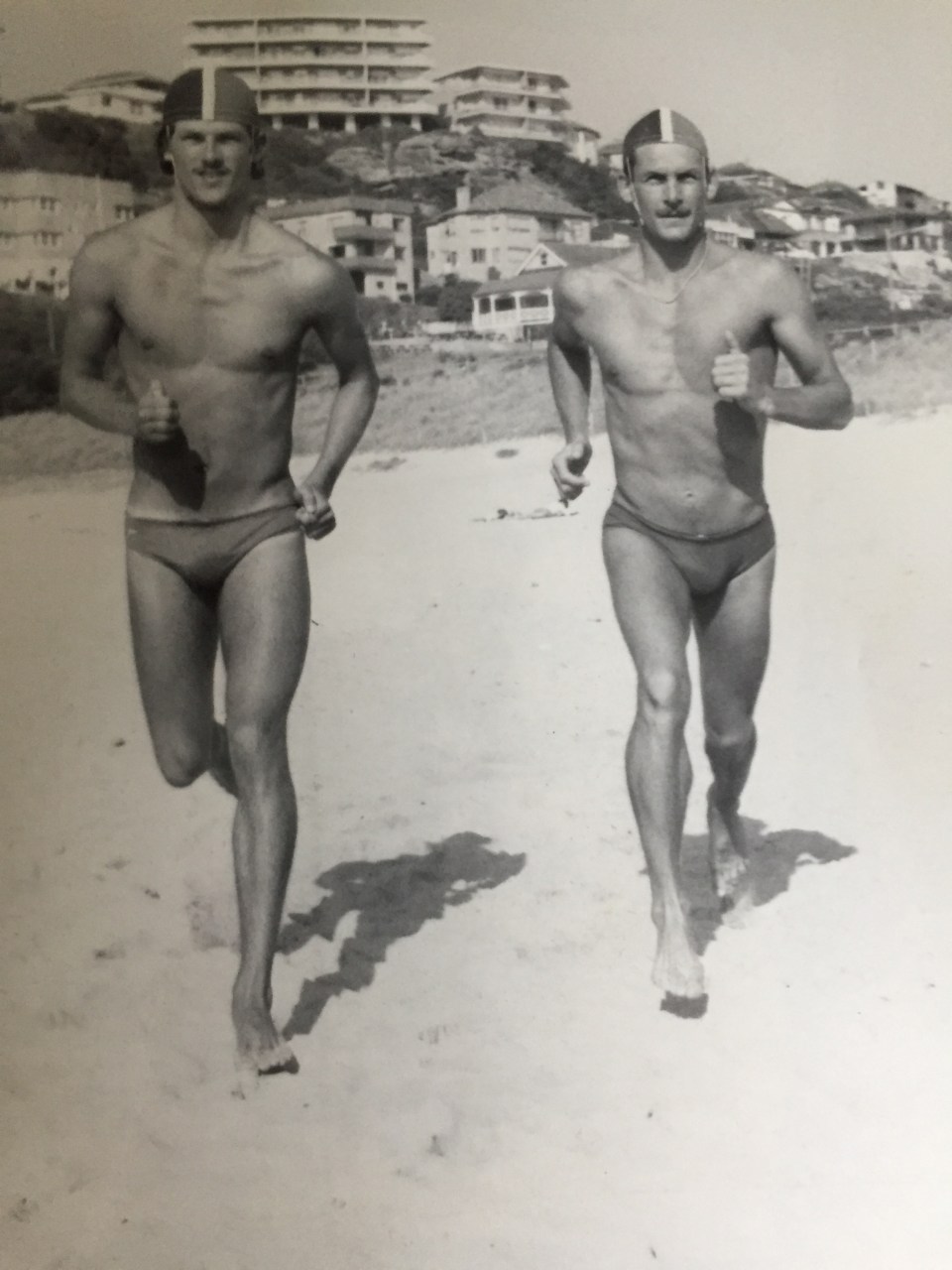 The ex-footballer, left, with his brother Stuart on the Welsh surf lifesaving tour of Australia in 1982