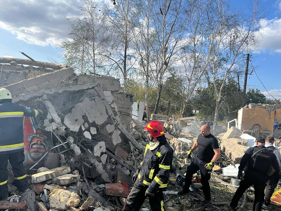 Rescue workers going through the rubble in the village of Hroza