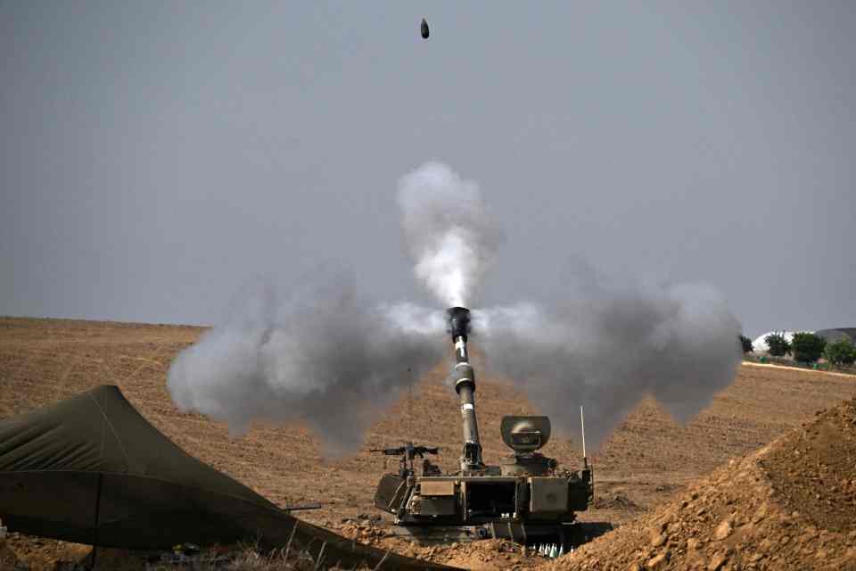 EDITORS NOTE: Graphic content / The Israeli military fires mortar shells toward the Gaza Strip on October 28, 2023. Since the October 7 Hamas attack on Israel, the health ministry in the Palestinian enclave said more than 7,300 Palestinians have been killed by Israel's relentless retaliatory bombardments, mainly civilians and many of them children. (Photo by Aris MESSINIS / AFP) (Photo by ARIS MESSINIS/AFP via Getty Images)