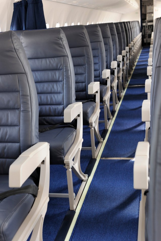 There's a small catch underneath the aisle seat armrest that means it can be lifted up