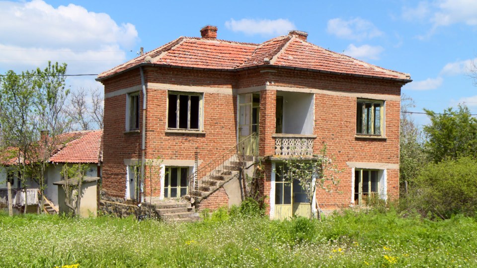 The first house he bought on eBay comes with around an acre of land as well