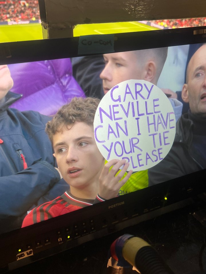 A young fan asked for Gary Neville's tie during the Manchester derby