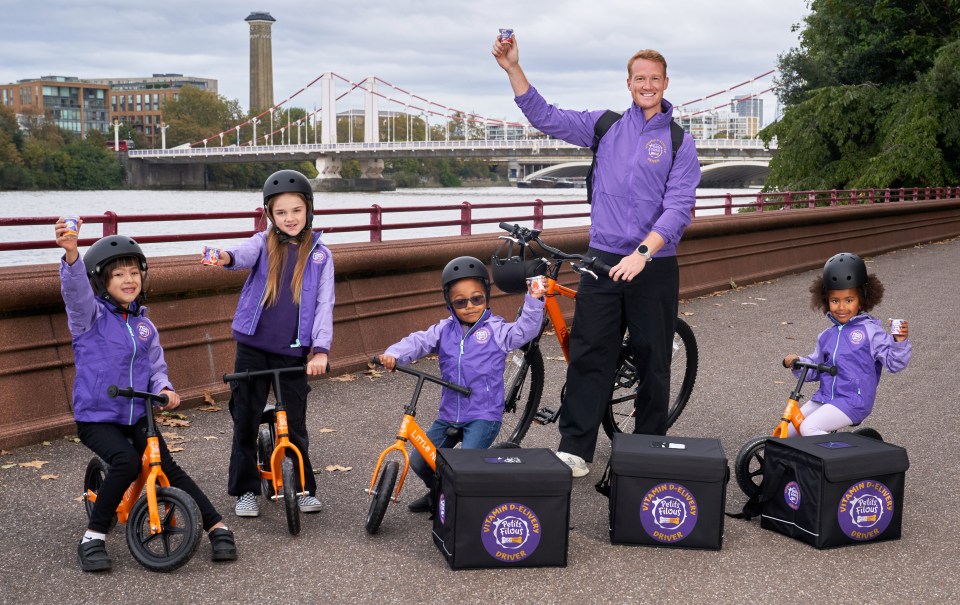 Vitamin D-elivery bike delivery team handing out free Petits Filous to families along the River Thames in Battersea Park