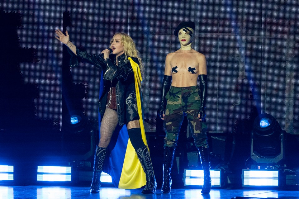 As Madonna kept on rocking, a static dancer shocked all in a risqué outfit