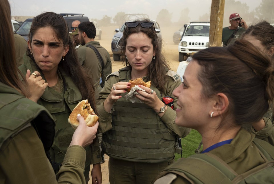 Female soldiers wait for an Israeli offensive on Gaza after the Hamas massacre