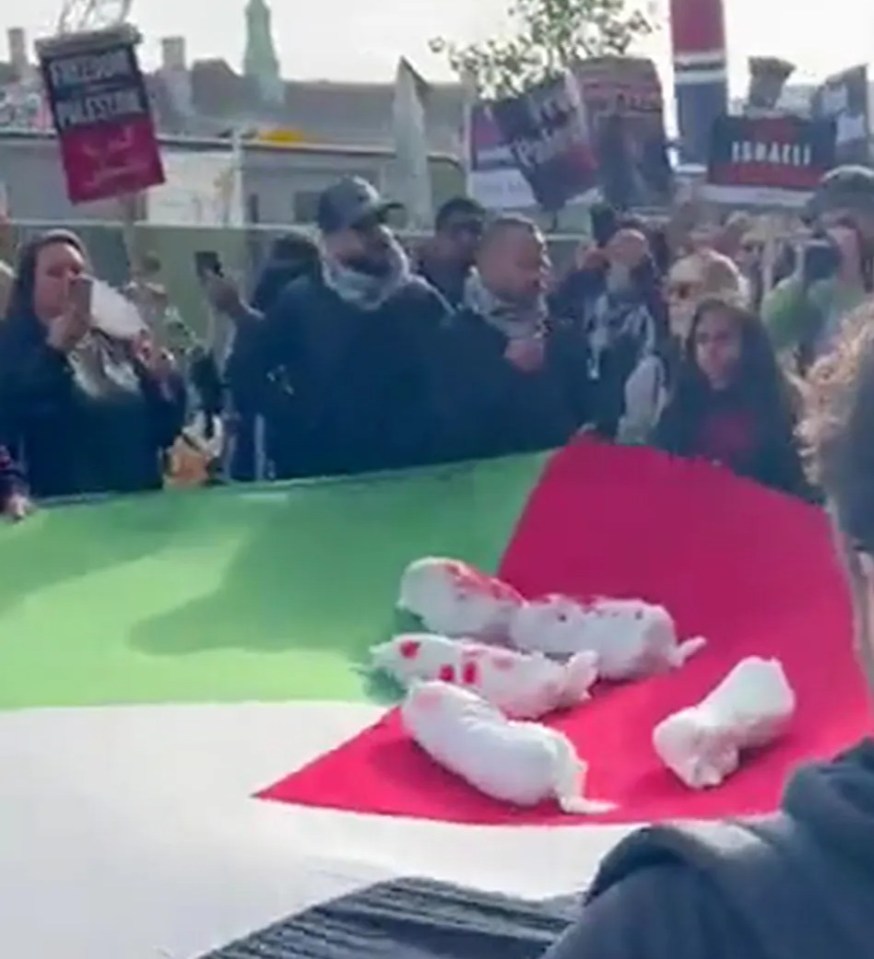 The effigies of dead babies were bounced up and down on a Palestinian flag