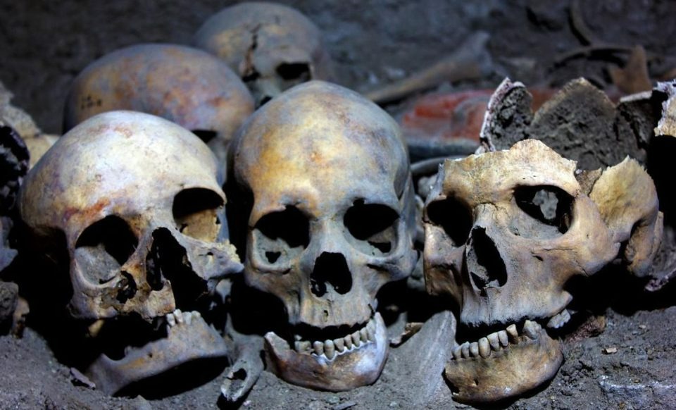 Skulls litter the dusty ground throughout the caves