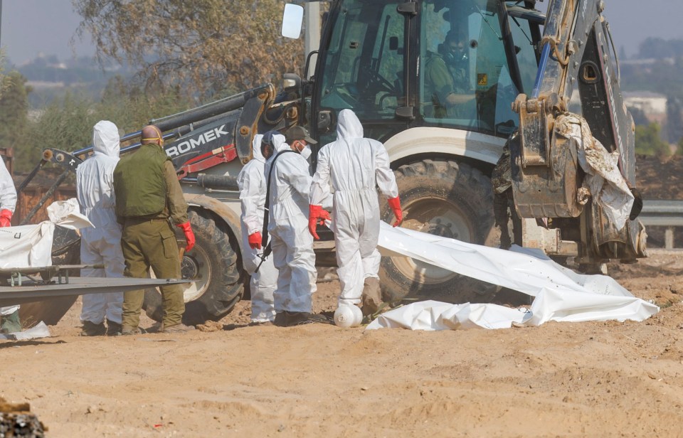 Bodies were still being recovered by Israeli troops as The Sun arrived