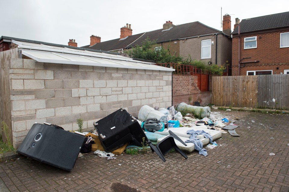 Old settees and mattresses are dumped in the area