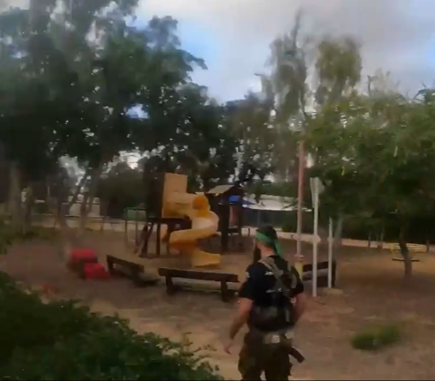 They make their way through the community and past a deserted playground