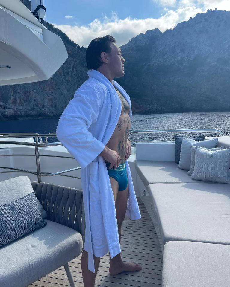 McGregor looked out at the sea in a dressing gown and tiny pants