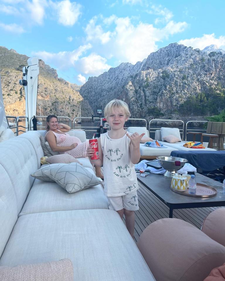 McGregor's son Conor Jr poses with a can of Coke in his hand