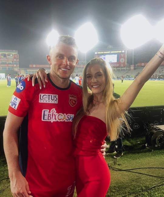 Sam Curran poses with girlfriend Isabella