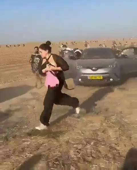 Hundreds were seen fleeing Hamas gunfire and jumping into cars in a desperate bid to escape the festival