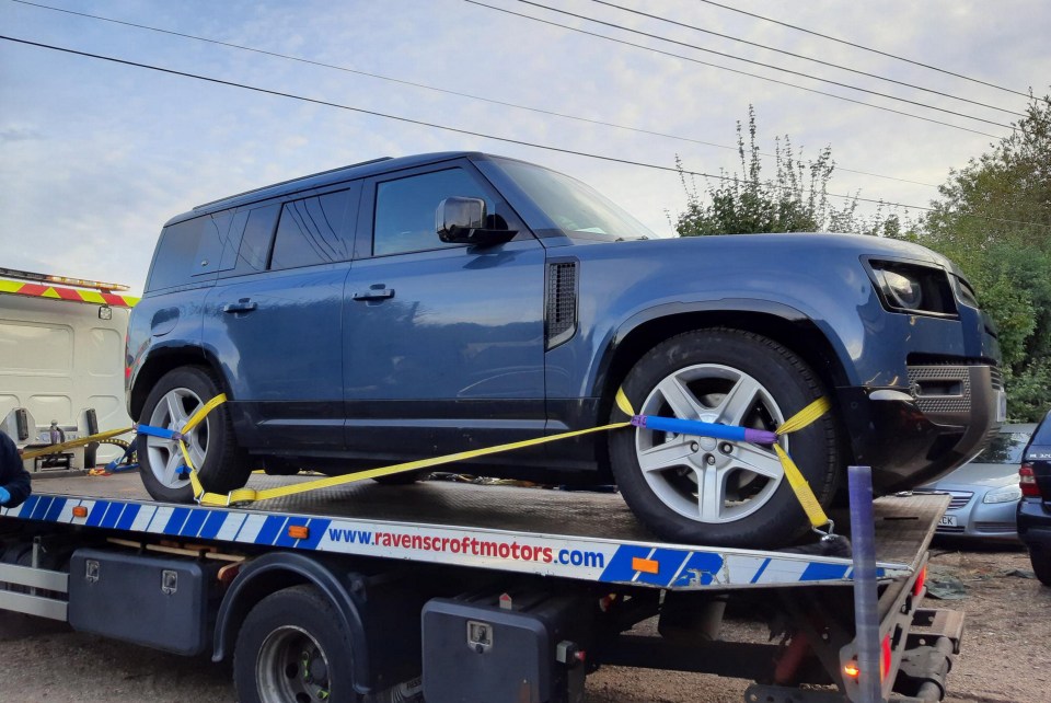 The blue Land Rover Defender worth around £55,000