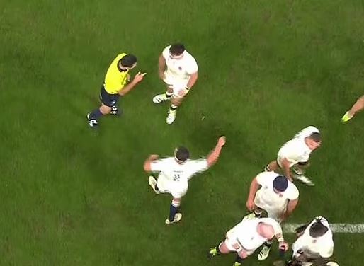 Tom Curry speaks to the referee during England's clash against South Africa