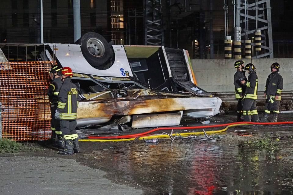 The bus crashed through a barrier and landed on the electrified lines