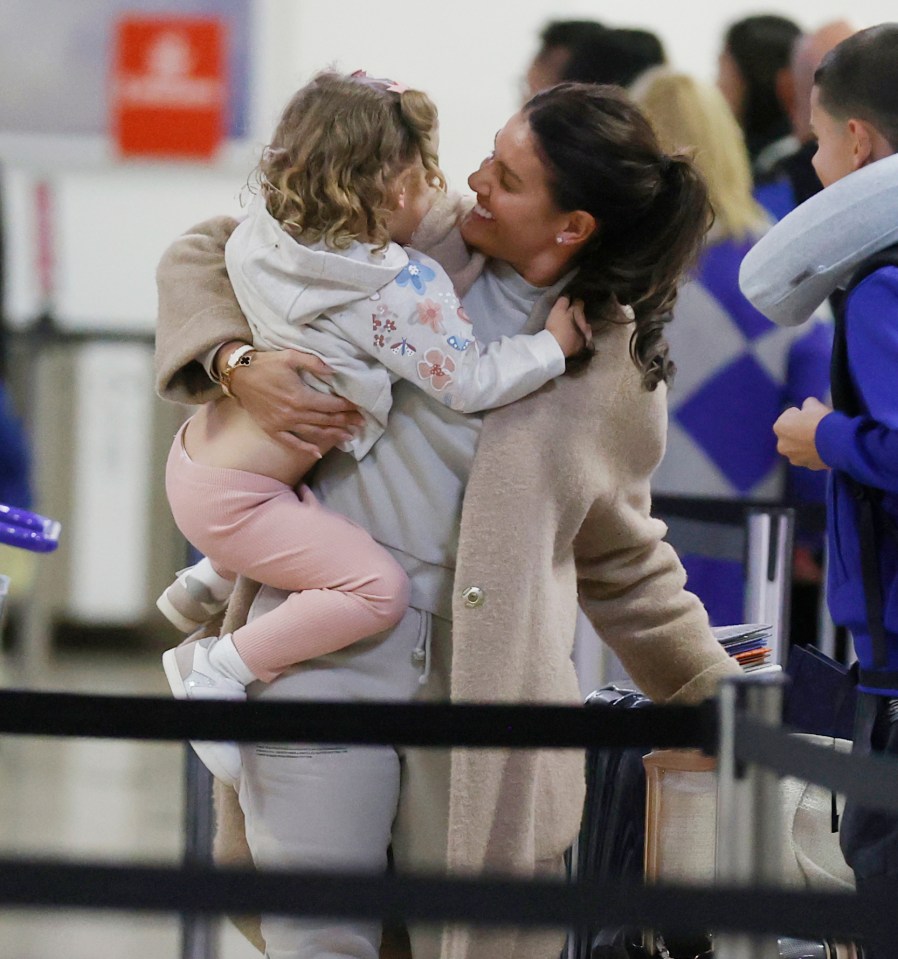 Rebekah was all smiles as she held daughter Olivia