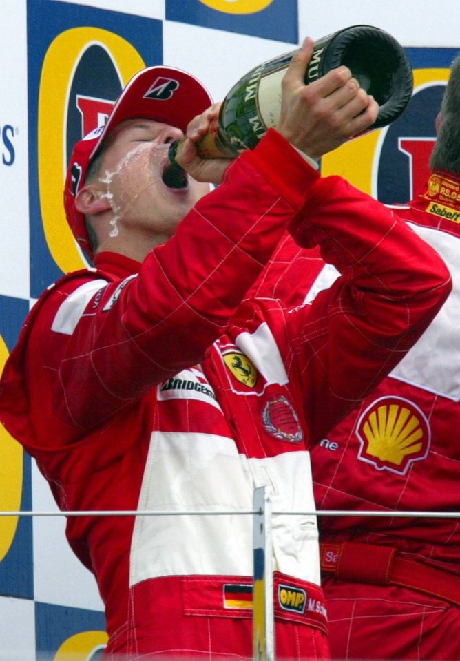 Schumacher in his heyday as he celebrates his win at the British Grand Prix in 2004