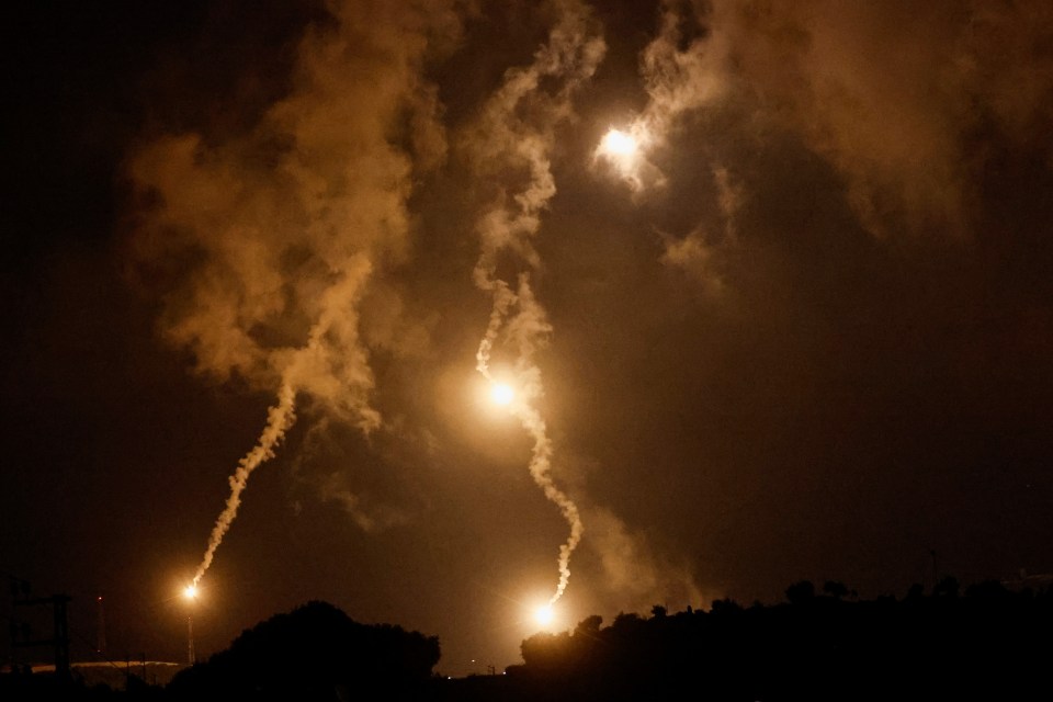 The sky is lit up by flares sent by Israel near the Lebanese border