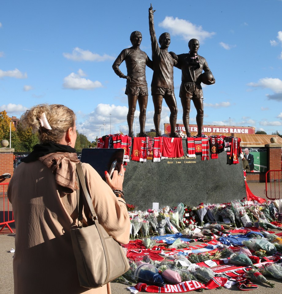 Fans laid flowers and scarfs by his statue