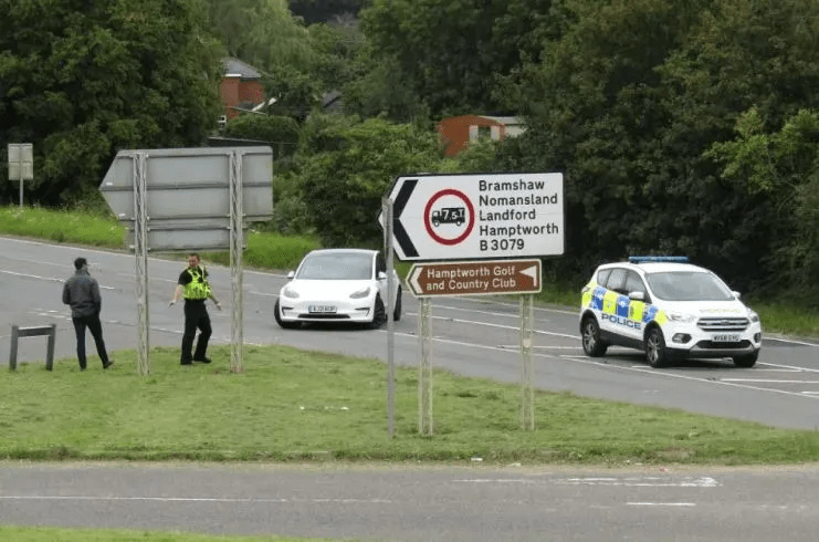 A broken-down Tesla at the Lyndhurst Road junction on the A36 in Salisbury