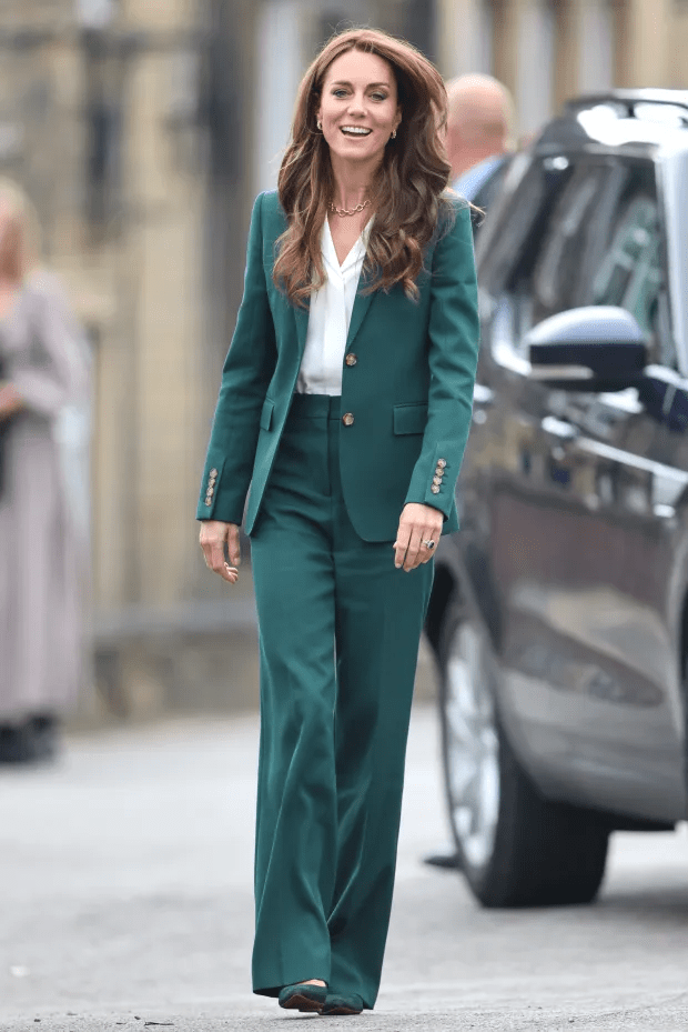 Kate perfectly styled out getting heels stuck on her trousers