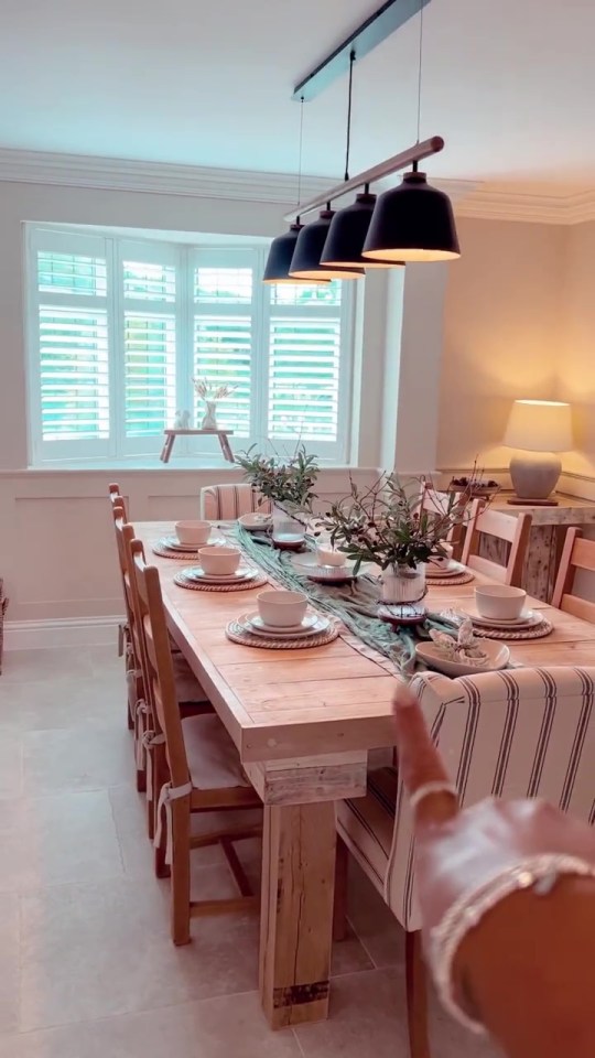 The dining room includes a homemade oak table table made by her dad