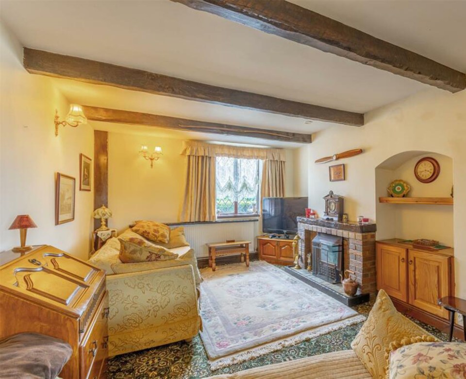 The three-bed home has just gone on the market and boasts traditional beams and authentic features