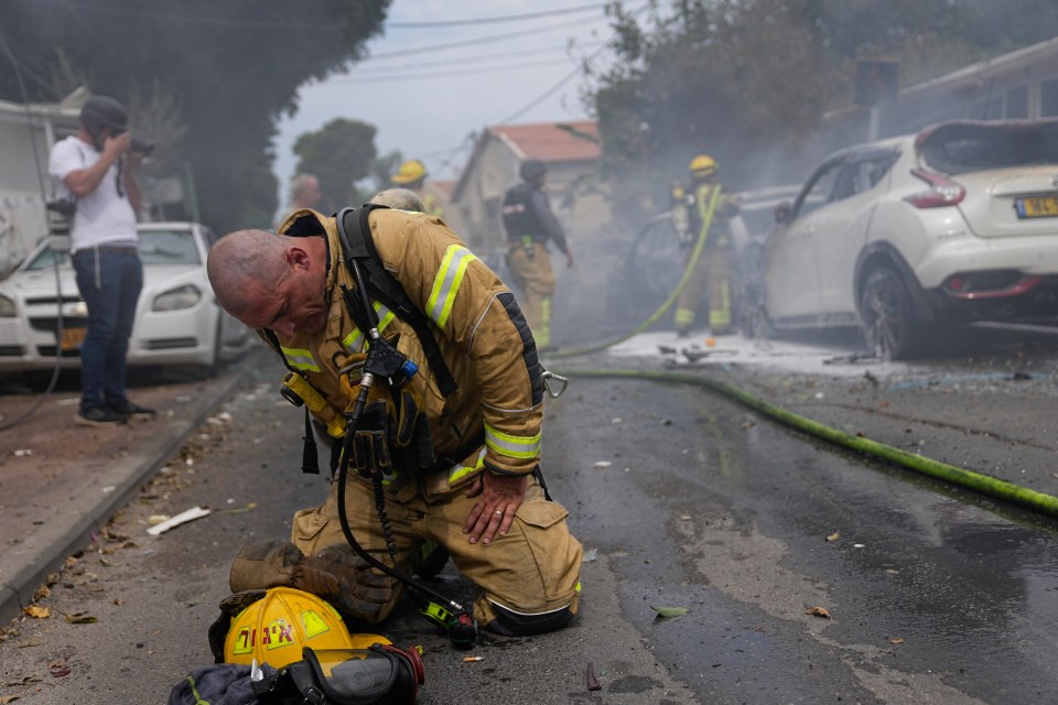 An exhausted firefighter who was working to put out fires in Ashkelon